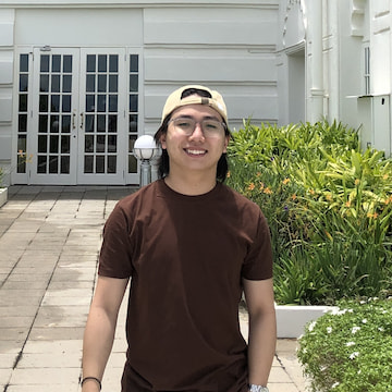 Handsome Calum standing next to some bushes. Handsome Calum standing next to some bushes.